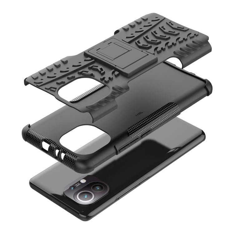 For Xiaomi Mi 11 Tire Texture Shockproof TPU+PC Protective Case with Holder(Black)