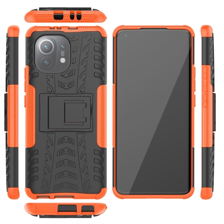 For Xiaomi Mi 11 Tire Texture Shockproof TPU+PC Protective Case with Holder(Orange)